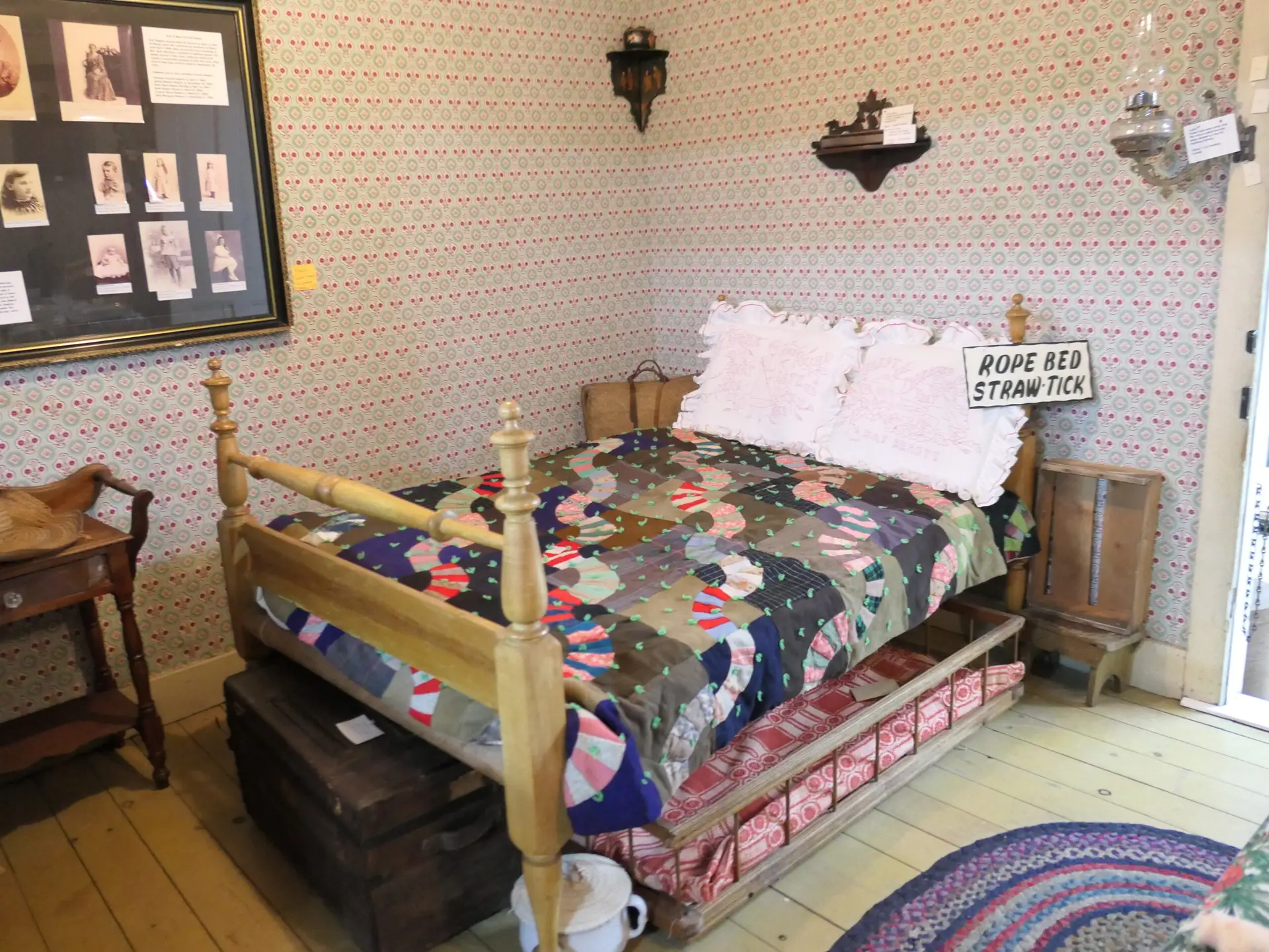 Rope bed with straw tick and trundle at McCallum Museum Brunson Heritage House in Sibley, Iowa – authentic 19th-century sleeping arrangement