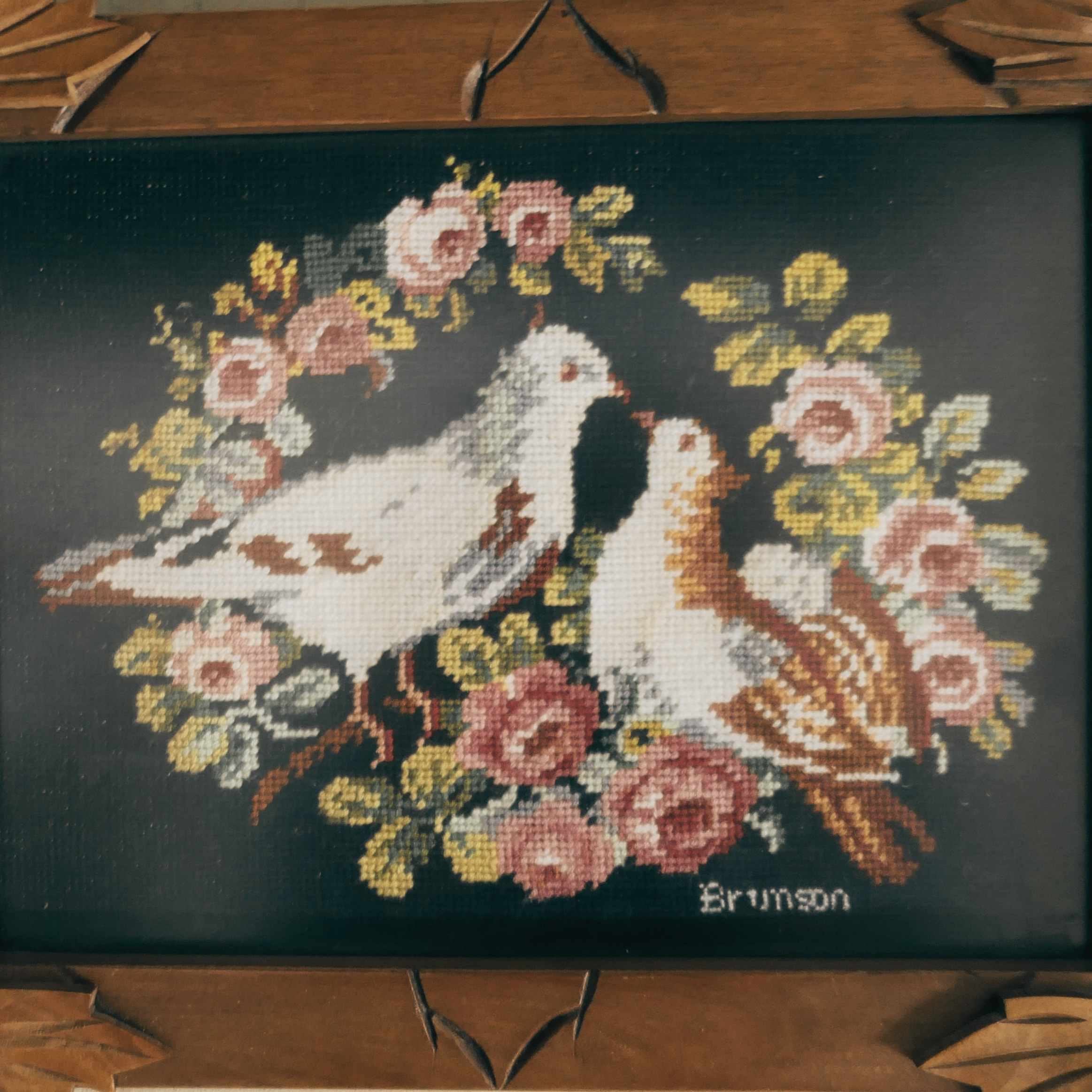 Doves Petit Point needlepoint by Dorothea Brunson on display at McCallum Museum Brunson Heritage House in Sibley, Iowa – one of her favorite bird subjects